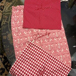 Travel Bags.  NEW - Set of 3 bags in a red pattern. Each bag is a different size